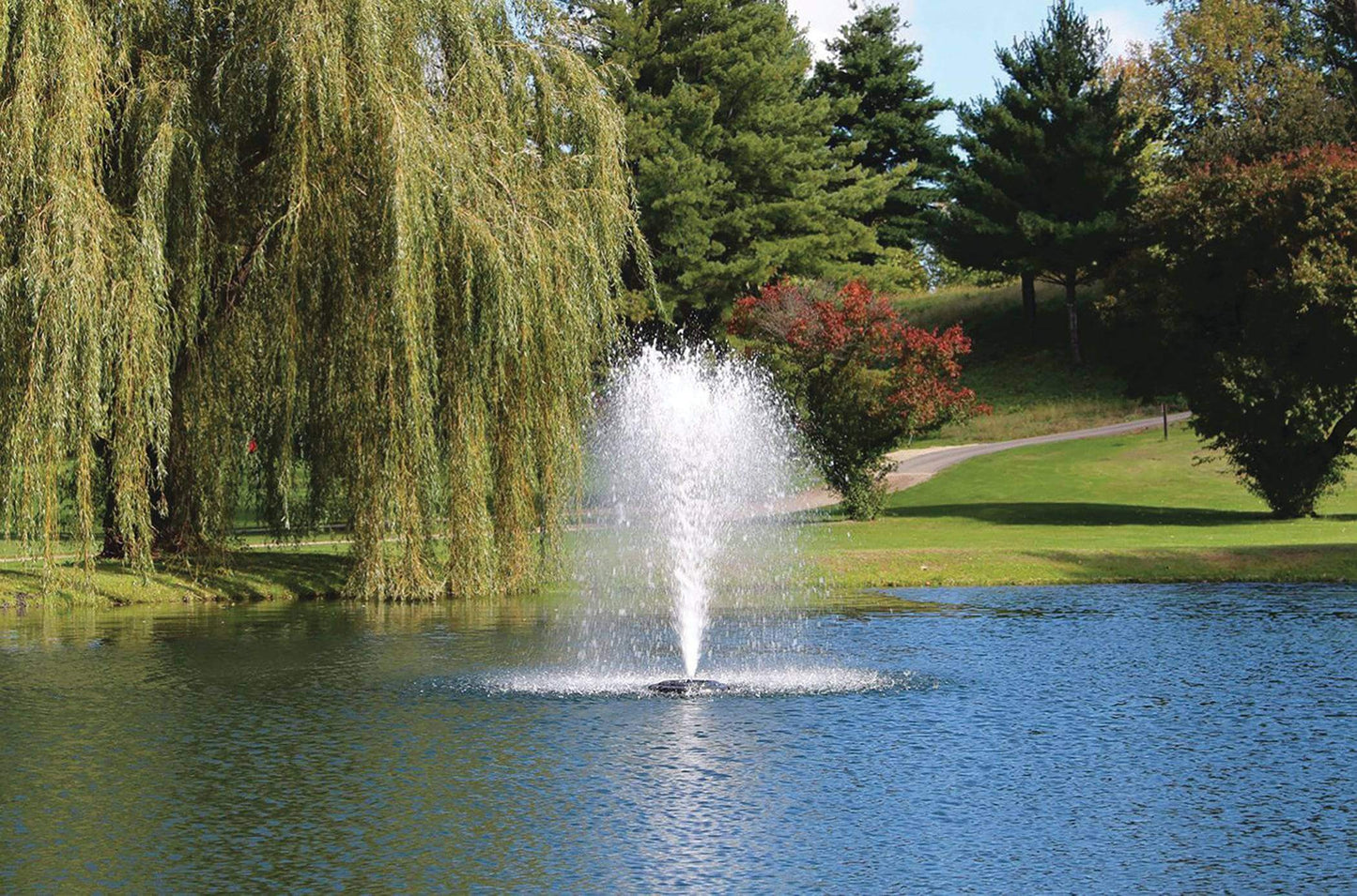 Kasco 3400HJF 3/4 HP Decorative Pond Fountain - 230v spraying decorative water pattern in landscaped pond