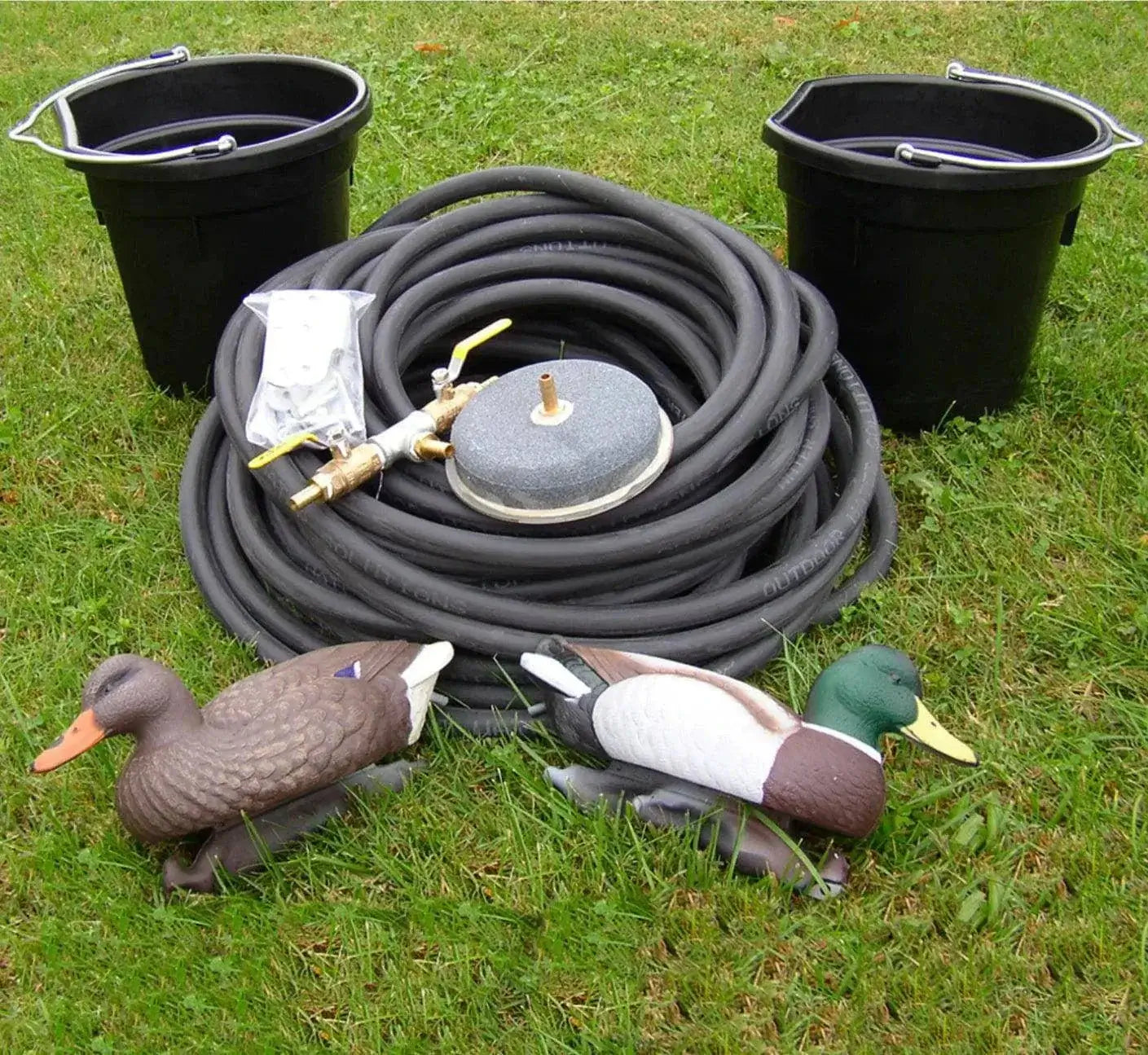 3 legged windmill pond aerator kit accessories with airline tubing, diffuser disc, and pond equipment on grass