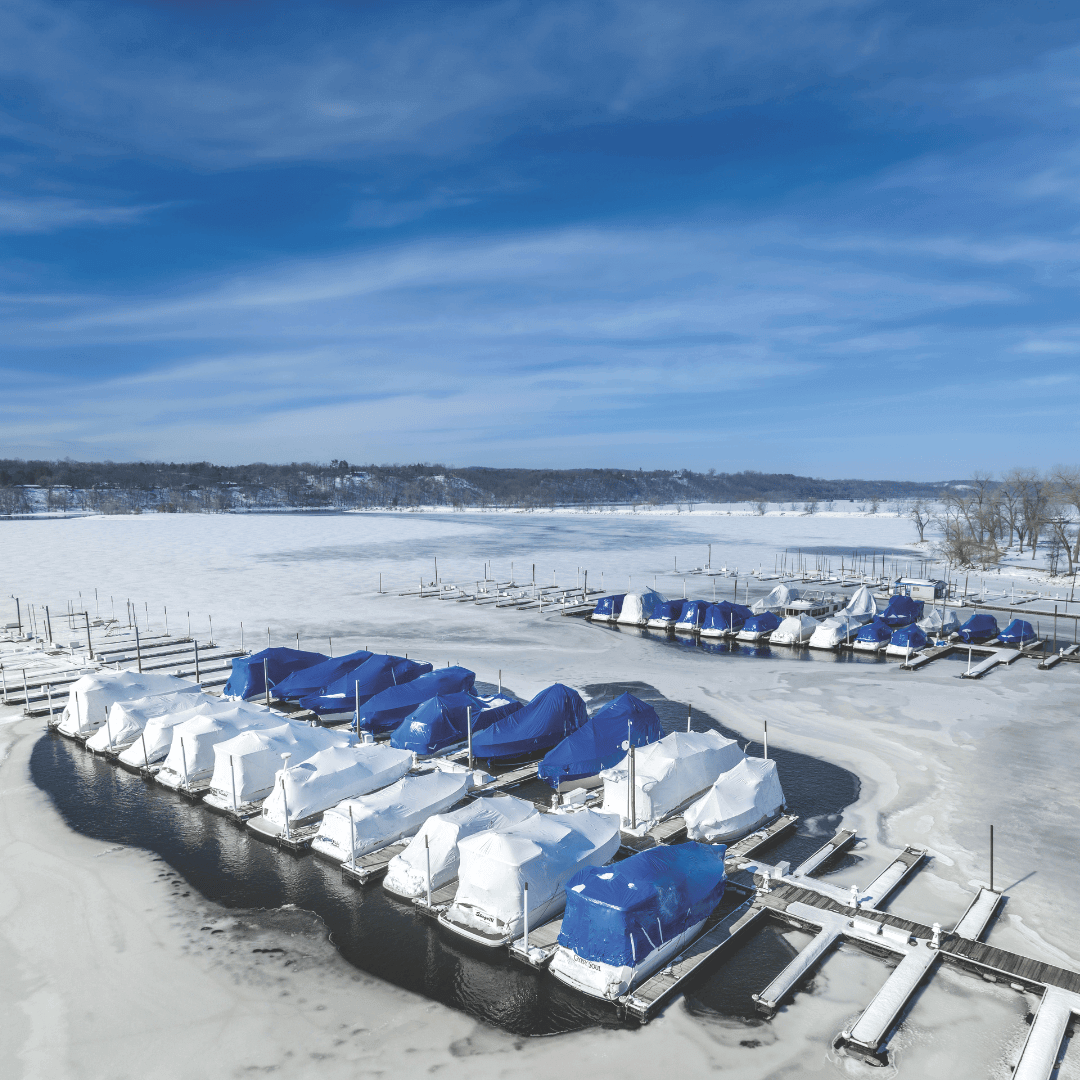 Kasco pond and lake de-icer keeping marina dock area ice-free in winter, protecting boats, lifts, and structures