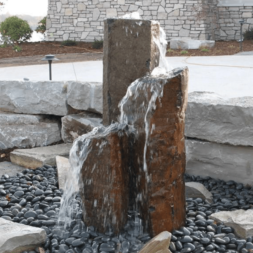 Close-up of Large Basalt Columns with natural cut tops, ideal for enhancing upscale residential and commercial landscaping.