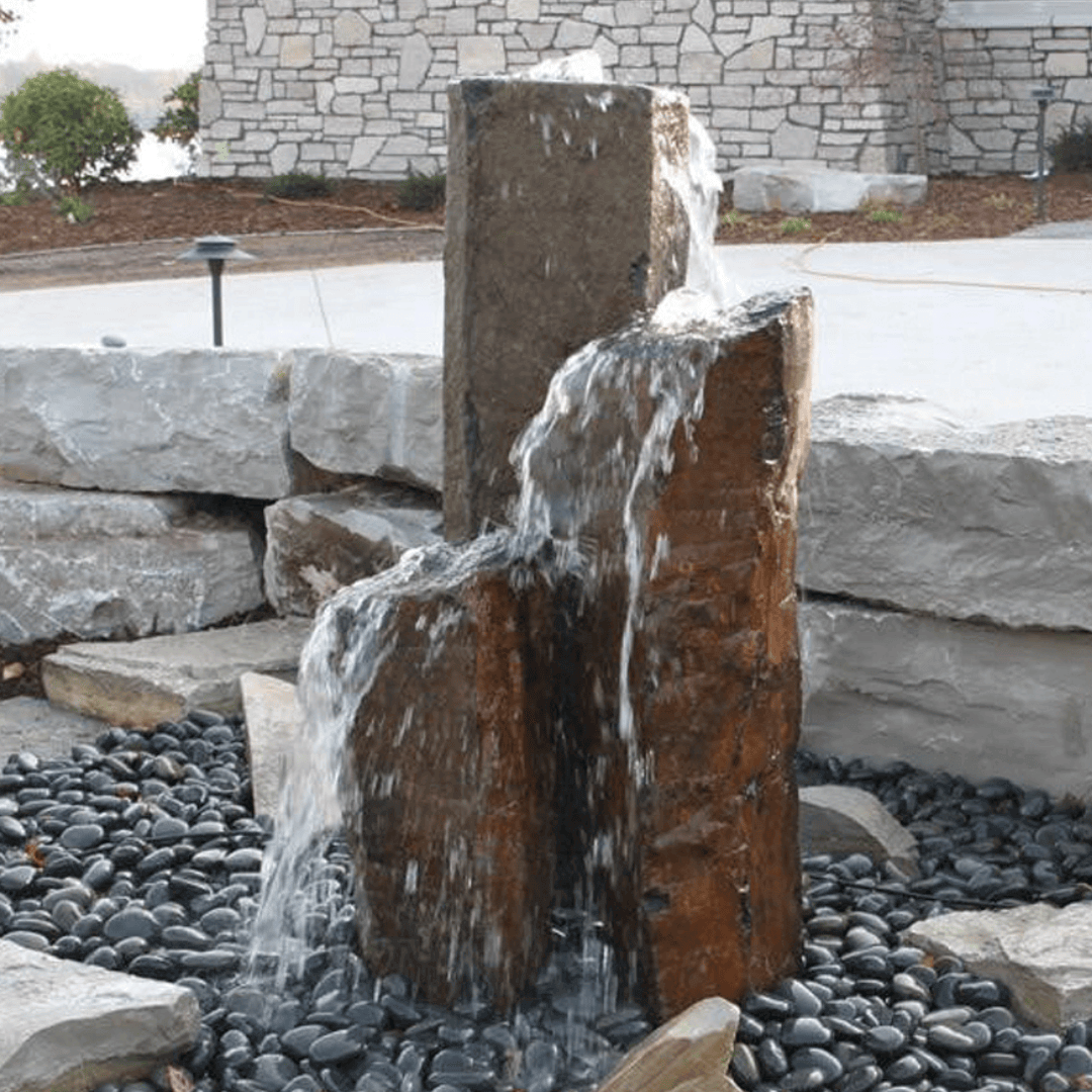 Large Basalt Columns 3', 5' and 7' bubbling rock fountain set with natural basalt pillars, core-drilled inlet, water feature