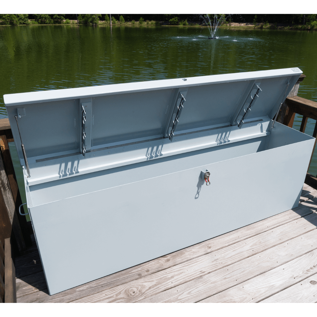 USA-made aluminum pond dock box open on wooden dock, weather-sealed marine-grade storage for boating and fishing gear