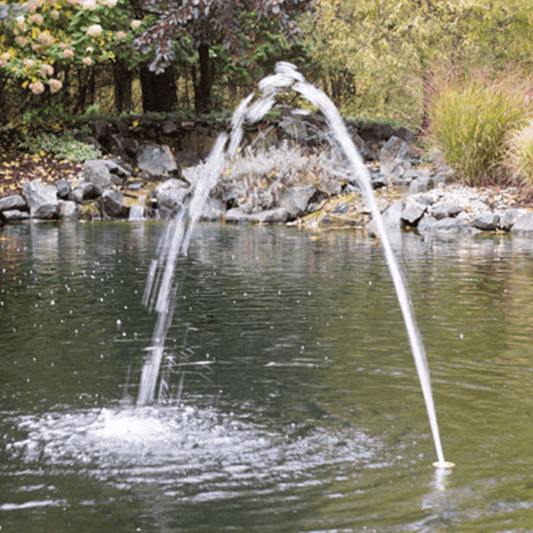 flush mount arching jet nozzle for splash pads and pools creating a clear arcing water stream in a pool