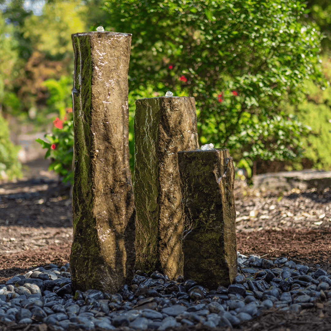 3-Pack Basalt Columns Kit featuring three natural beauty basalt columns, suitable for an indoor or outdoor bubbling water feature, including an LED light kit for nighttime display.