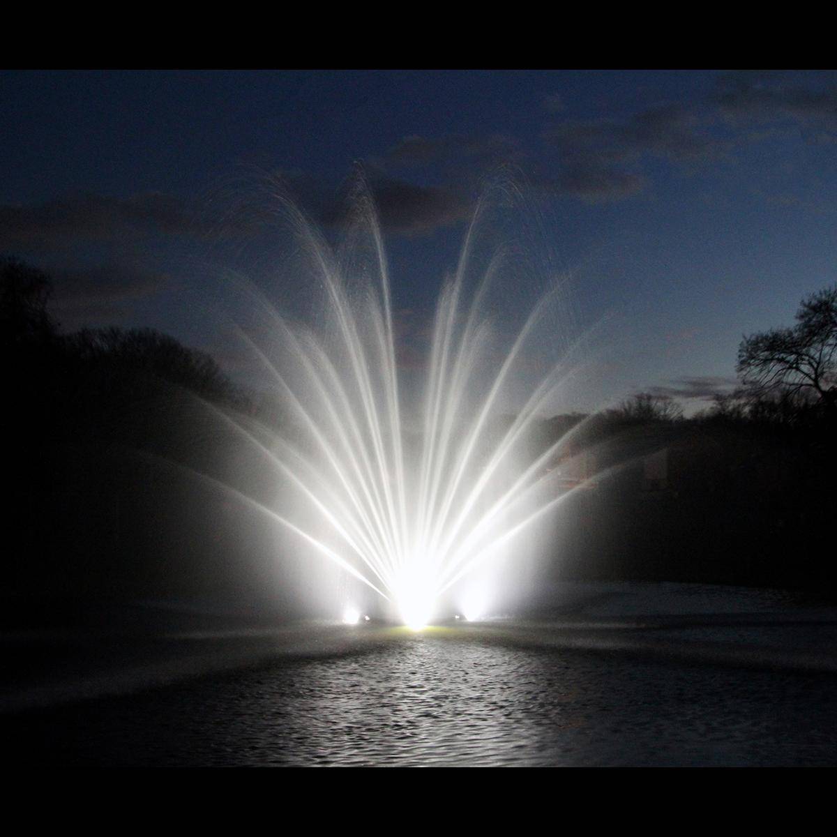 Otterbine Fountain Glo MAXI-RGBW 4 light kit illuminating fountain spray at night with bright RGBW lighting