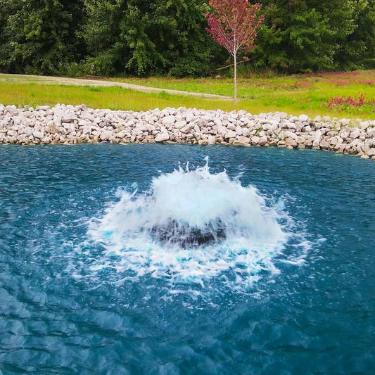 Scott Aerator Boilermaker 1.5 HP surface aerator running in a landscaped pond