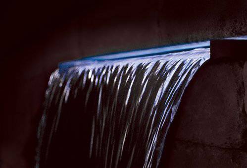 12V waterproof white LED strip light illuminating waterfall spillway, 35-inch strip with 15-foot cord and 10W transformer
