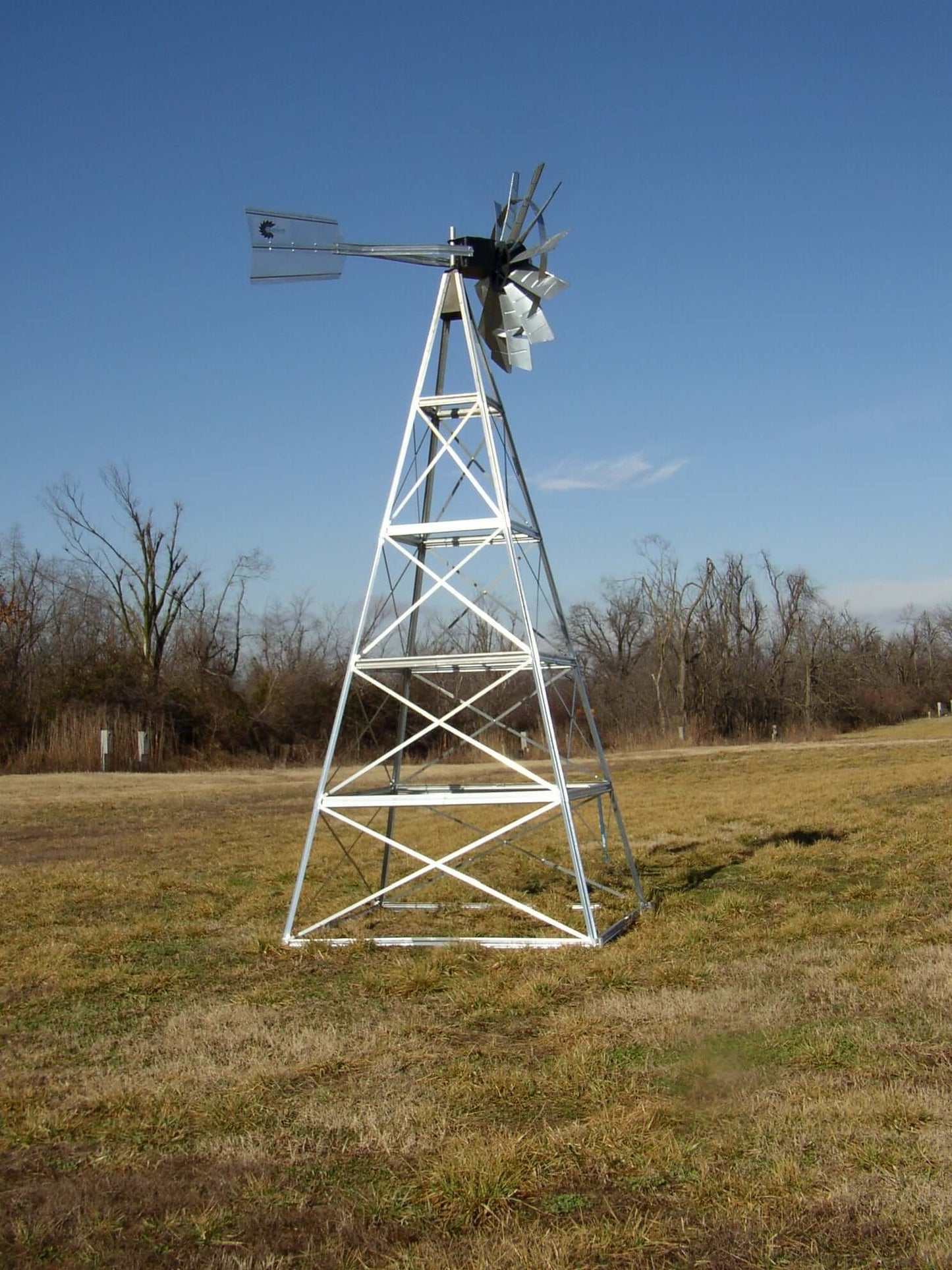 4 legged windmill pond aerator kit four-legged outdoor windmill tower aerator system in open field
