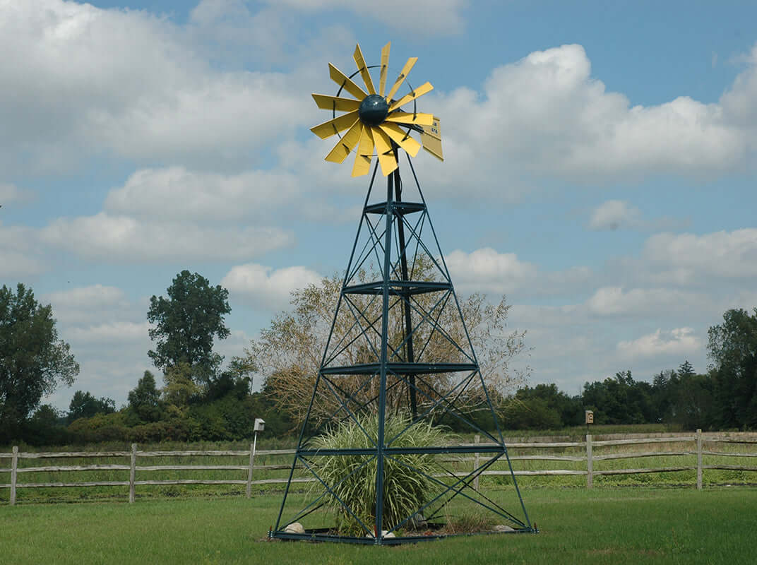 20 ft windmill pond aeration system powder coated tower windmill in grassy field under blue sky
