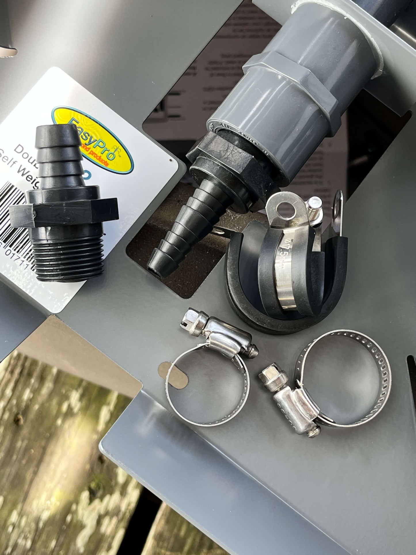 barb check valve for diffuser with clamps - black barb fitting, check valve connector, and stainless hose clamps on diffuser unit