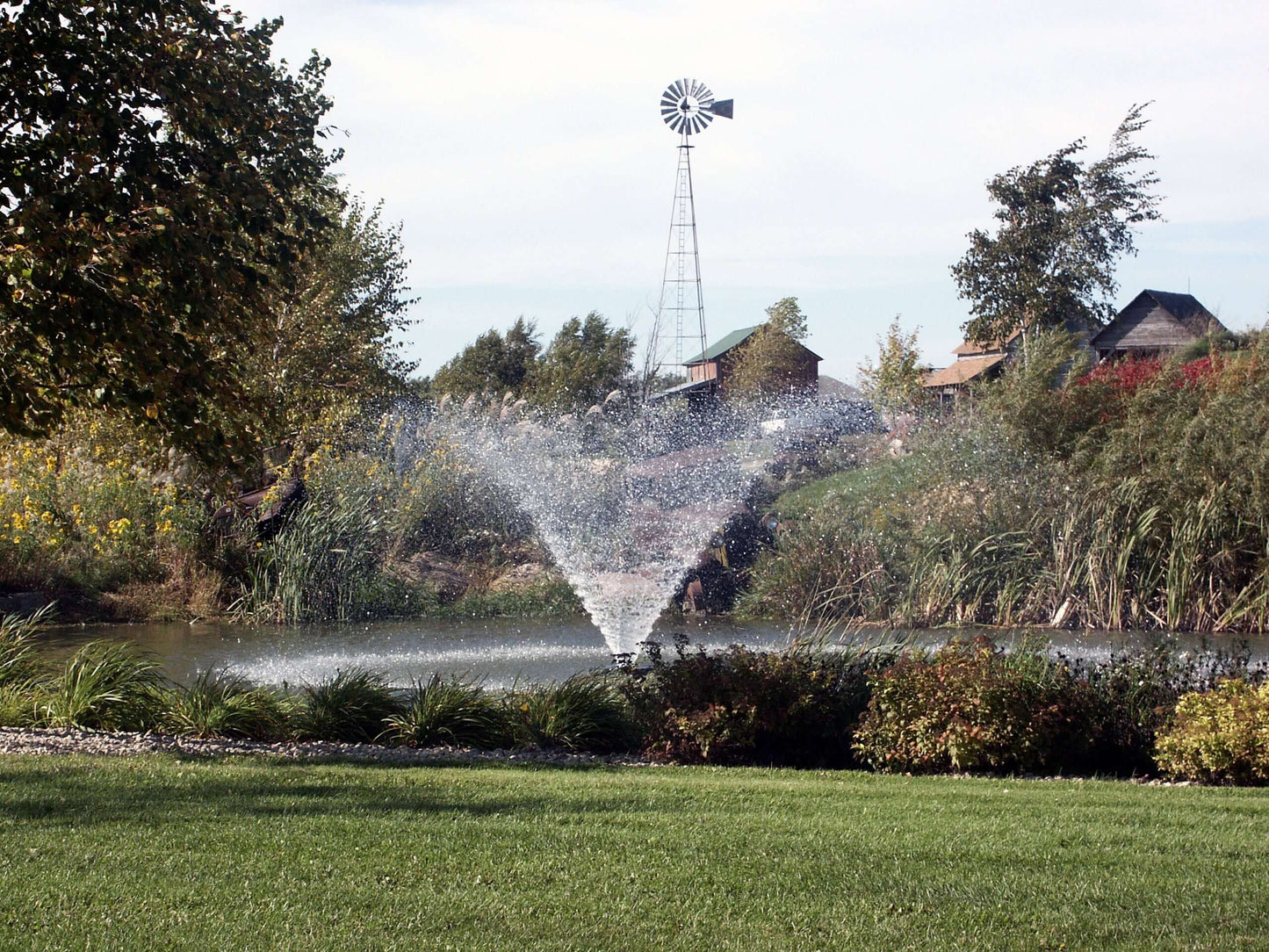 Kasco 4400VFX 1 HP pond fountain aerator 120V spraying decorative fountain display in a landscaped pond