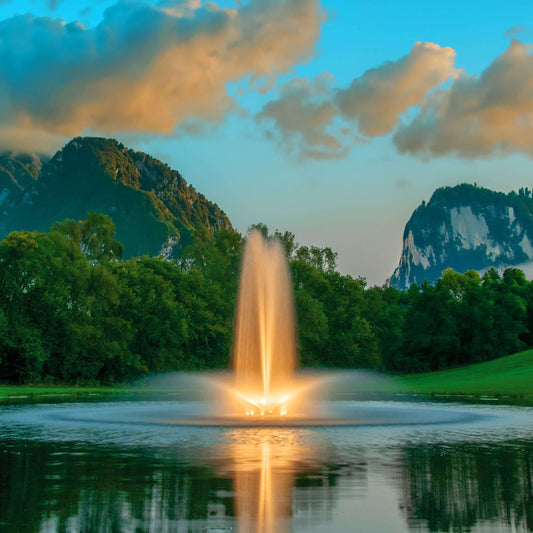 Kasco J Series fountain lit amber at dusk with 3-light LED kit