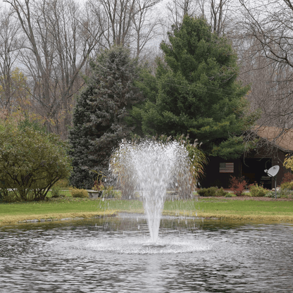 Alt Tag: AquaFloat™ Floating Fountain Head with Narrow Umbrella Nozzle creating narrow umbrella spray in backyard pond fountain
