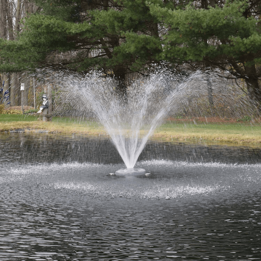 Alt Tag: AquaFloat™ Floating Fountain Head with Wide Umbrella Nozzle spraying wide umbrella pattern on pond with floating fountain head