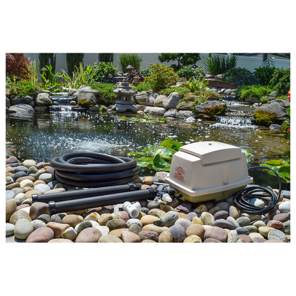 EasyPro LA15W linear pond aerator kit with compressor, weighted airline and diffuser beside a garden pond