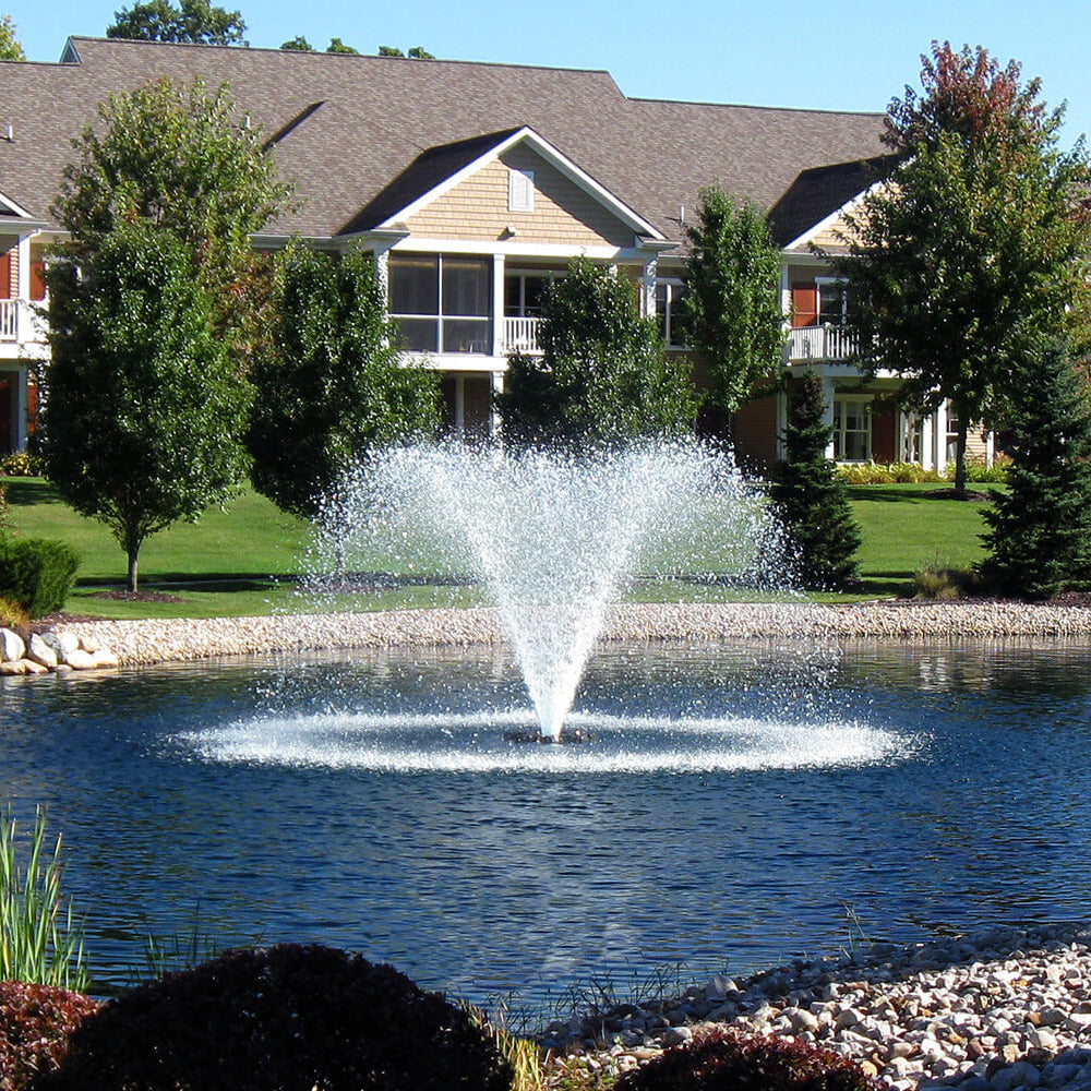 Otterbine Gemini floating aerating fountain with wide V-shaped twin spray installed on a pond