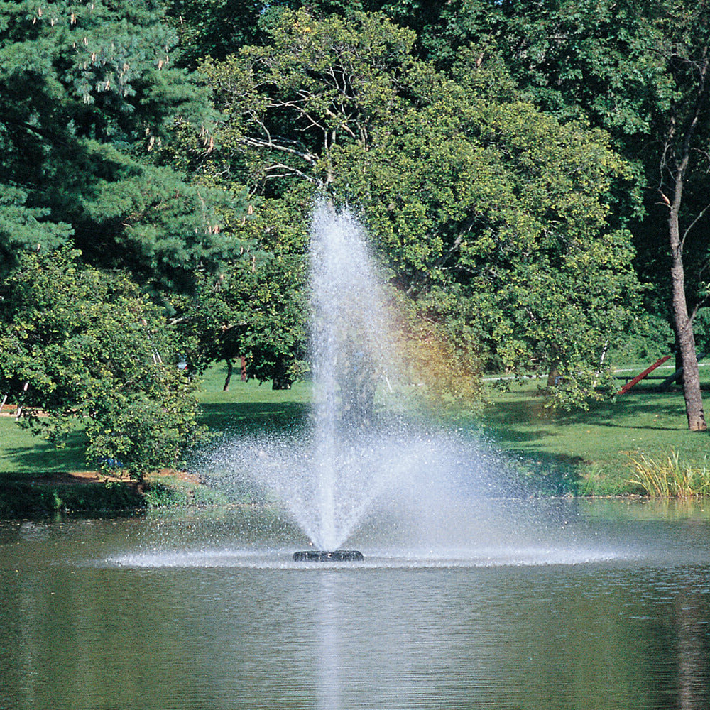 Otterbine Phoenix floating aerating fountain with tall feathered plume spray installed on a pond