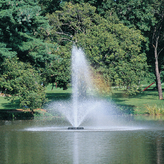 Otterbine Phoenix floating aerating fountain with tall feathered plume spray installed on a pond