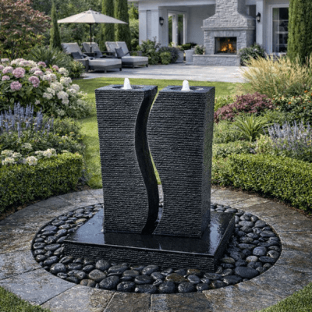 Riverbend Granite Columns Fountain Kit gray granite bubbling column fountain kit modern sculptural water feature in landscaped backyard patio
